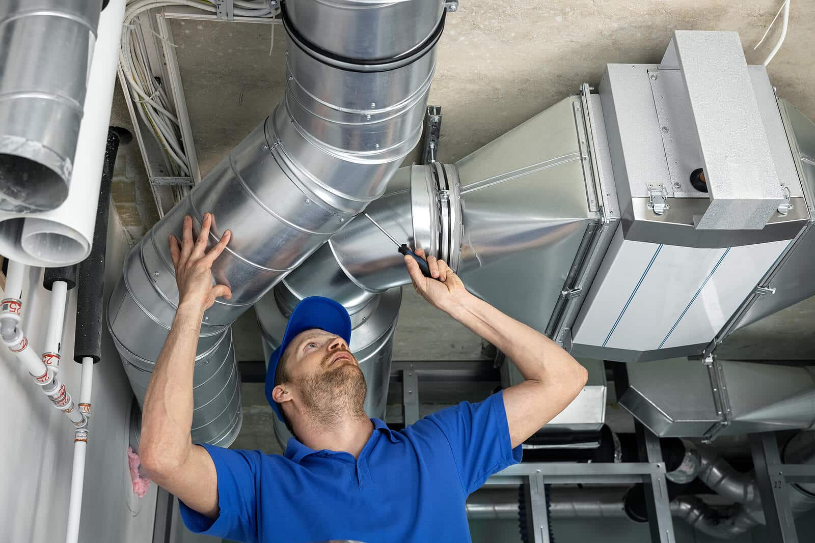 HVAC technician inspecting and repairing air ducts in Lomita