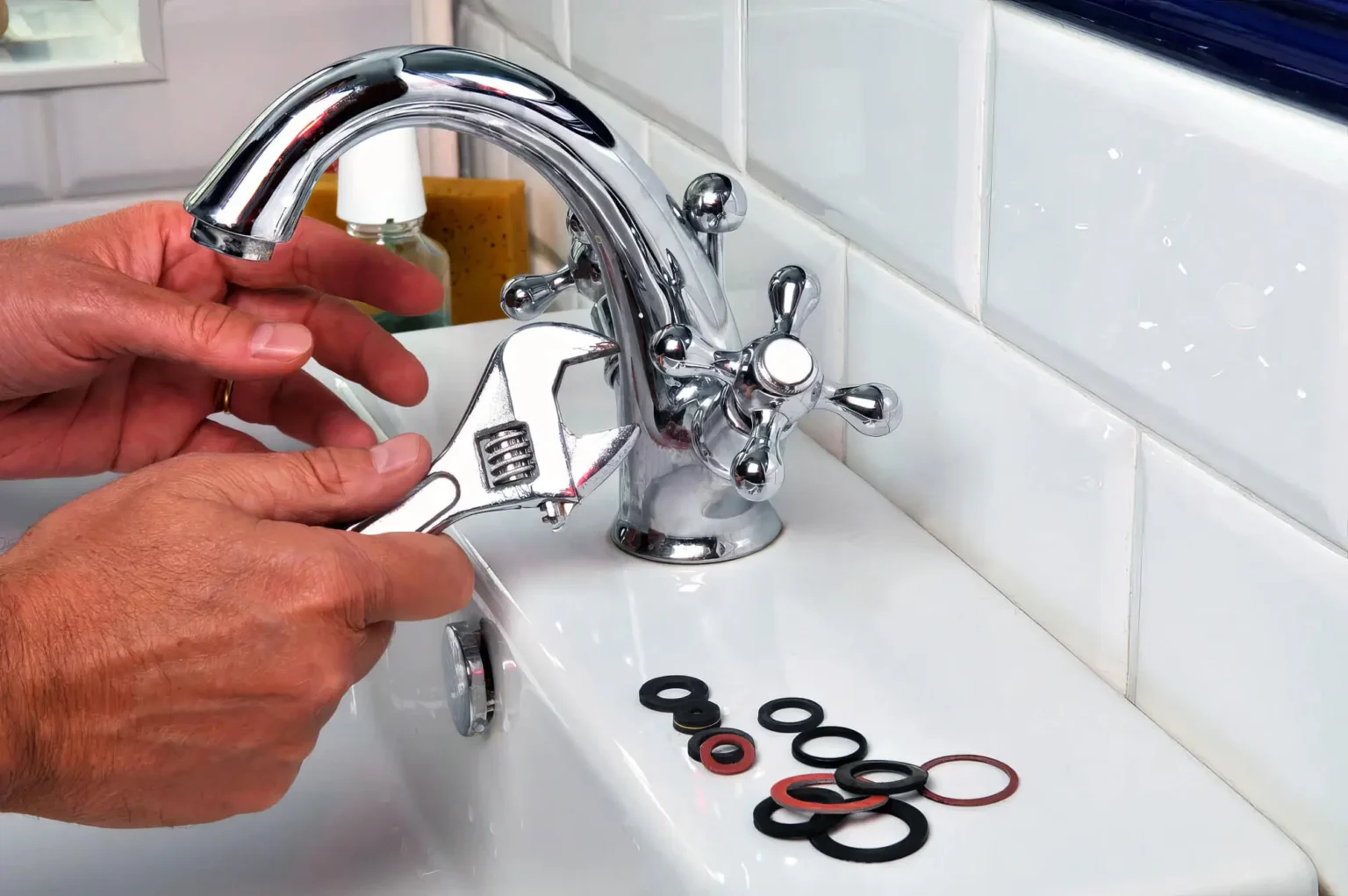 Plumber maintaining a bathroom faucet in Lomita