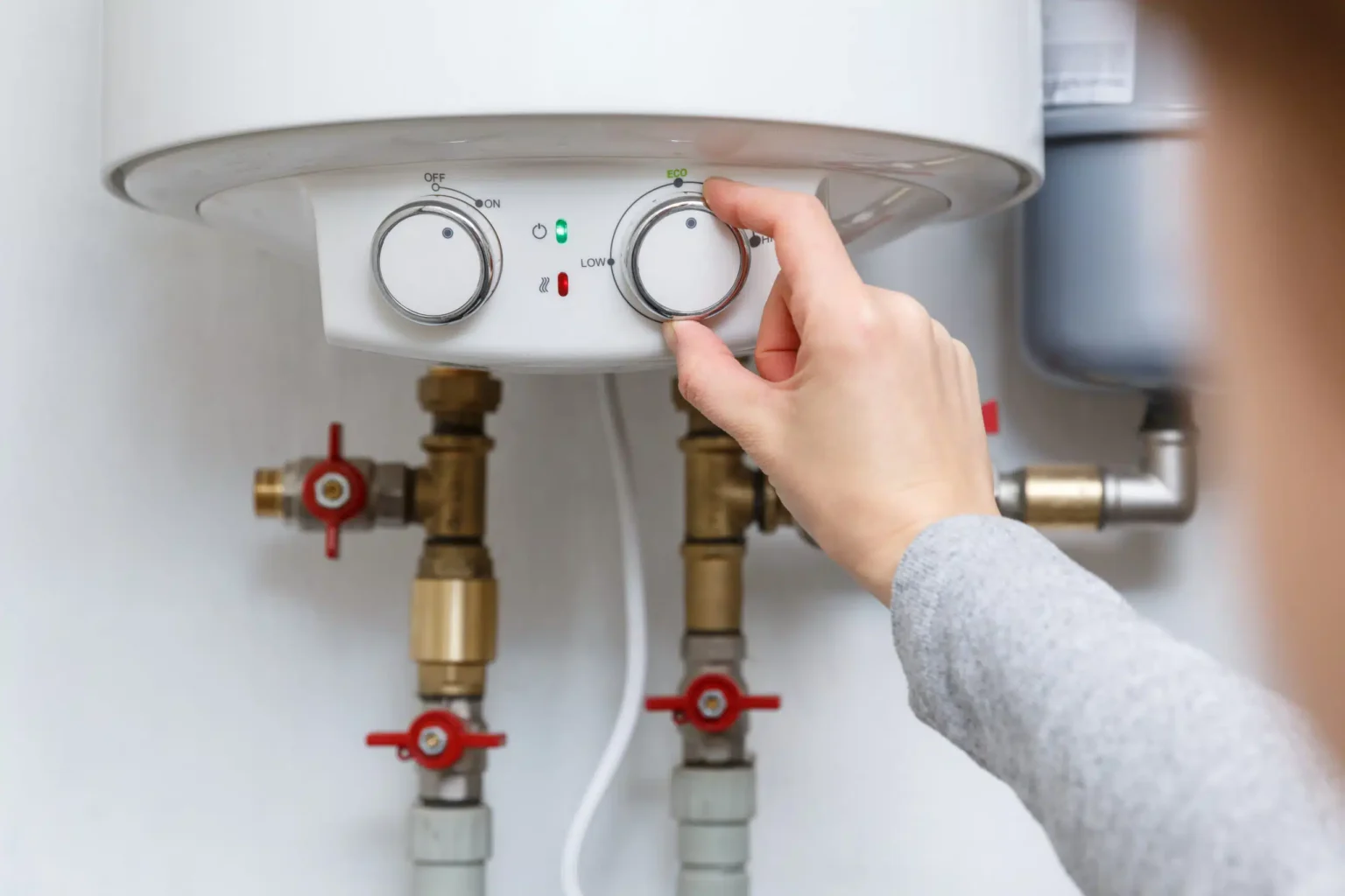 Technician adjusting a water heater in Lomita